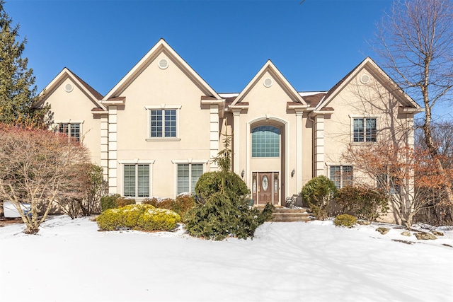 traditional home with stucco siding