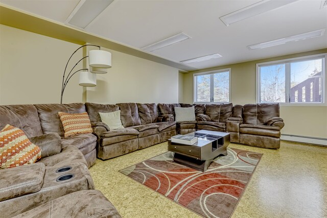 living area with a baseboard heating unit and carpet flooring