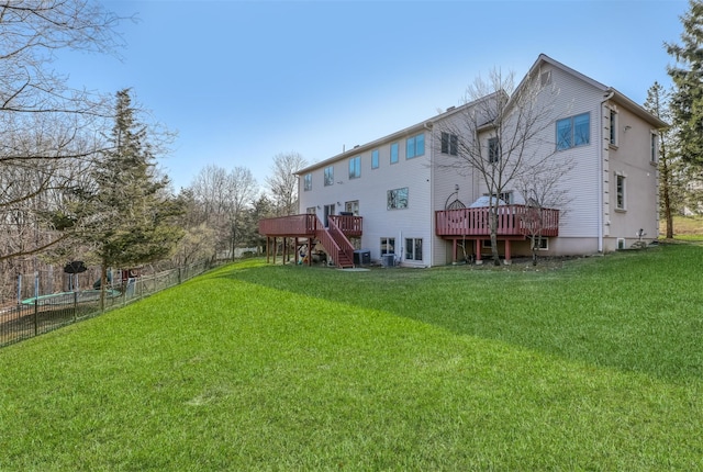 back of property featuring stairs, fence, a yard, cooling unit, and a wooden deck