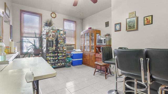 office featuring ceiling fan and light tile patterned floors