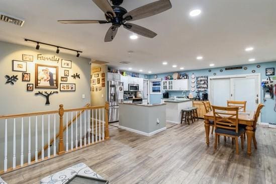 dining area featuring light wood-style flooring, visible vents, baseboards, and recessed lighting