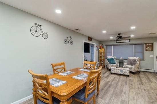 dining space featuring baseboards, a ceiling fan, a baseboard radiator, wood finished floors, and recessed lighting