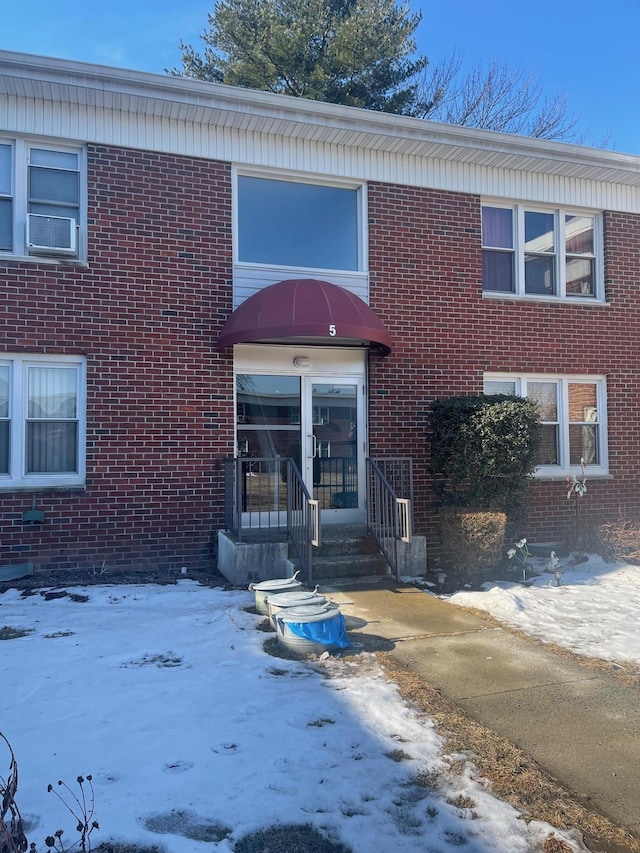 view of front of house featuring brick siding