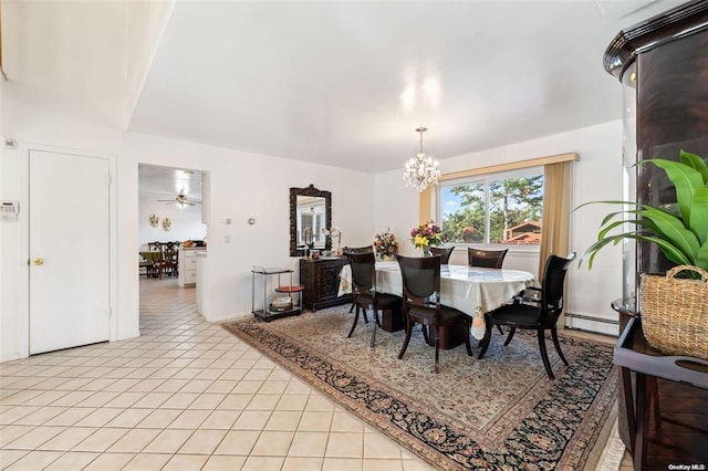 dining room featuring a chandelier, light tile patterned floors, and a baseboard radiator