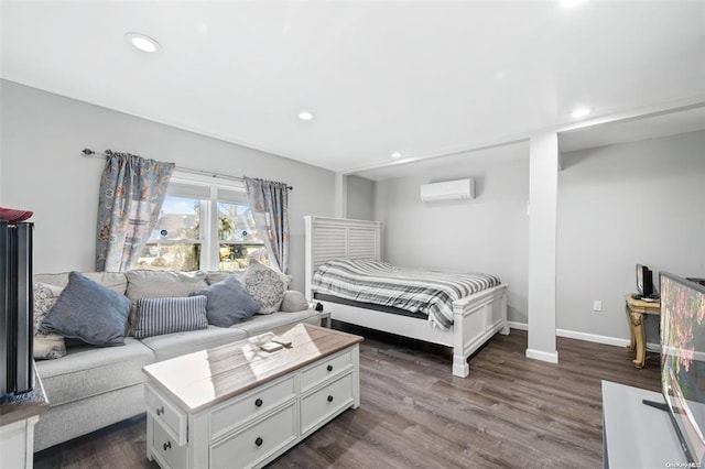 bedroom with recessed lighting, baseboards, dark wood-type flooring, and a wall mounted AC