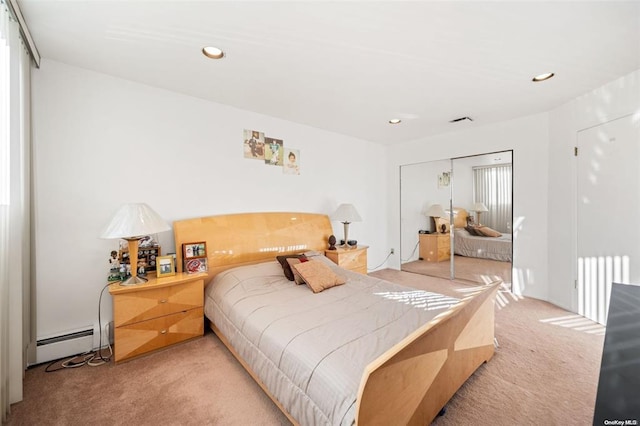 bedroom with a baseboard radiator, recessed lighting, light colored carpet, a closet, and radiator heating unit