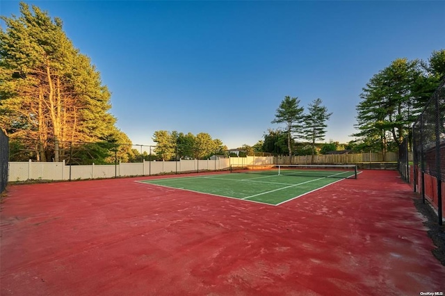 view of sport court with fence