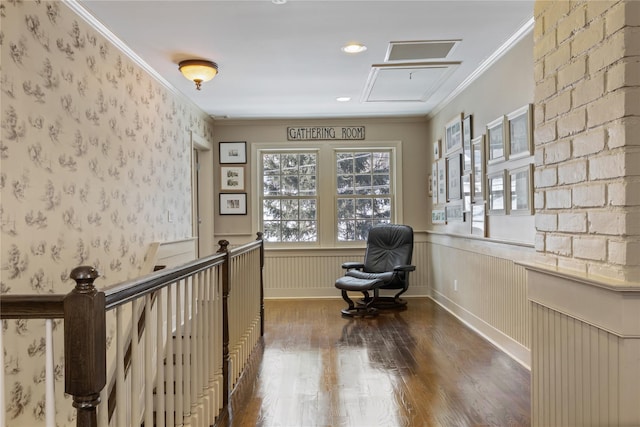 hall with wallpapered walls, wainscoting, wood finished floors, and crown molding