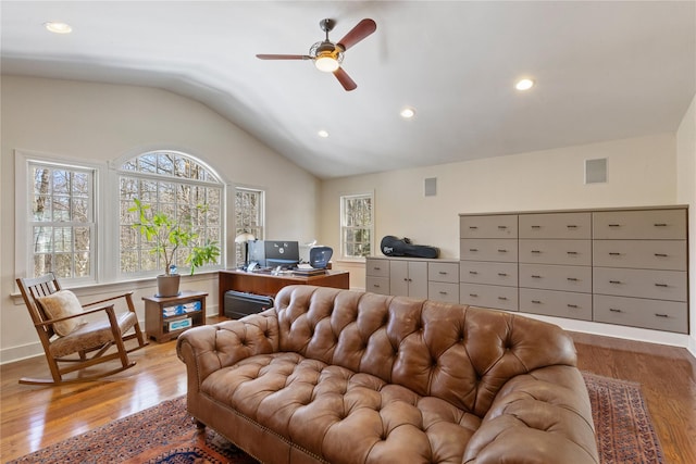 living room featuring lofted ceiling, recessed lighting, a ceiling fan, wood finished floors, and baseboards