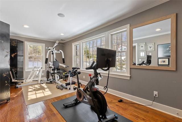 workout room with crown molding, baseboards, wood finished floors, and recessed lighting