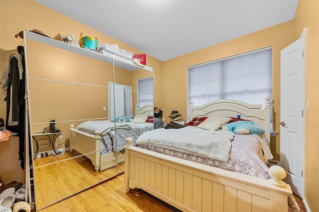 bedroom with wood finished floors