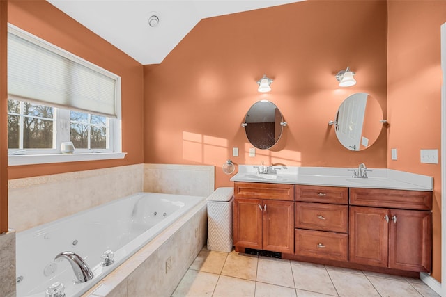 bathroom featuring lofted ceiling, tile patterned flooring, a sink, double vanity, and a tub with jets