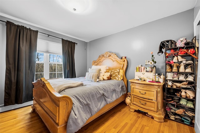 bedroom with wood finished floors