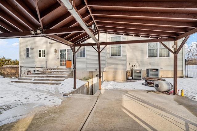 exterior space with entry steps and central AC unit