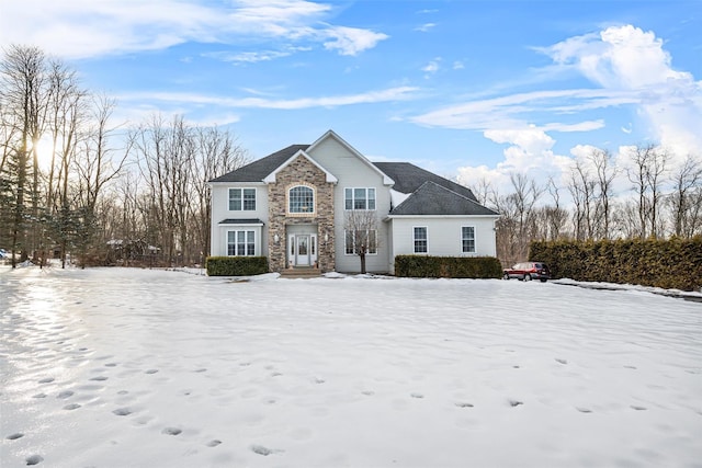 traditional-style home featuring stone siding