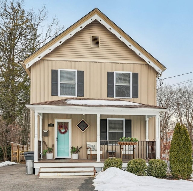 view of front of house featuring board and batten siding and covered porch