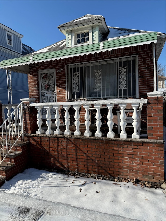 view of front of house with brick siding