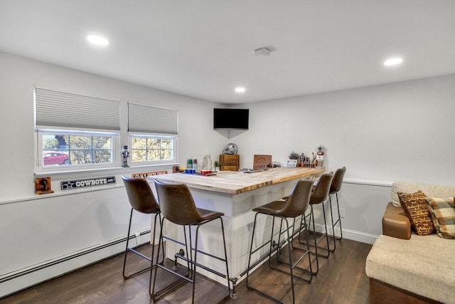 bar featuring a baseboard heating unit, recessed lighting, dark wood-style flooring, and baseboards