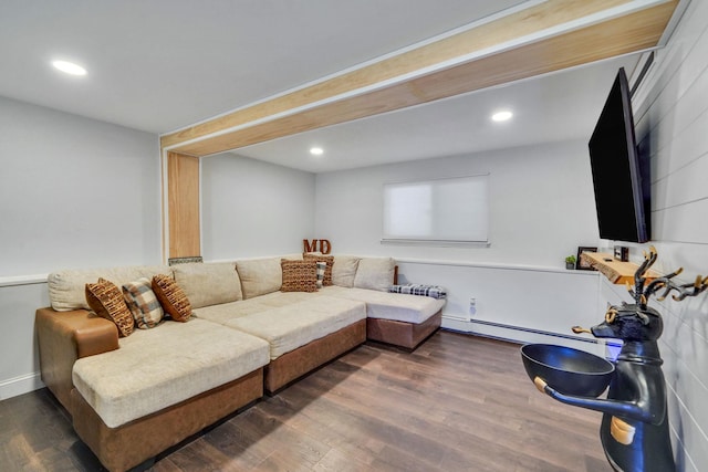 living room with a baseboard heating unit, dark wood-type flooring, and recessed lighting