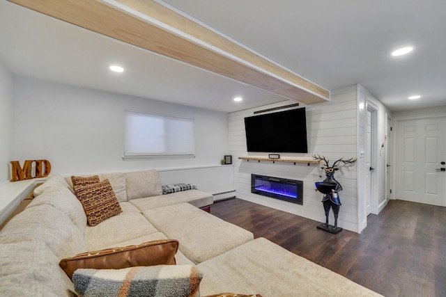 living room with dark wood-style floors, recessed lighting, a glass covered fireplace, and a baseboard radiator