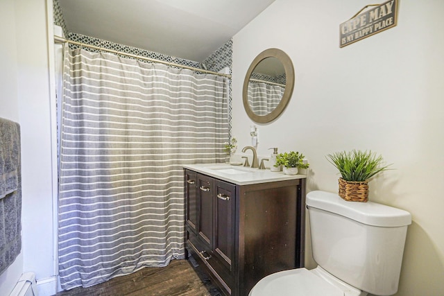 full bathroom with a shower with shower curtain, vanity, toilet, and wood finished floors