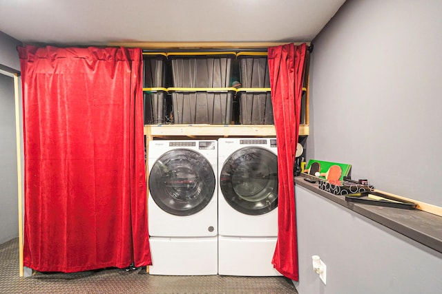 laundry area with washing machine and dryer