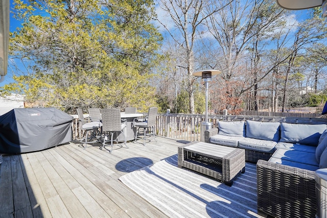 deck featuring area for grilling and an outdoor living space