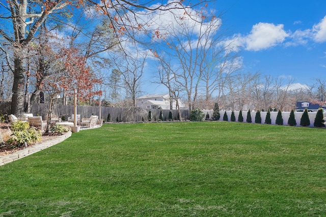 view of yard with fence and a patio