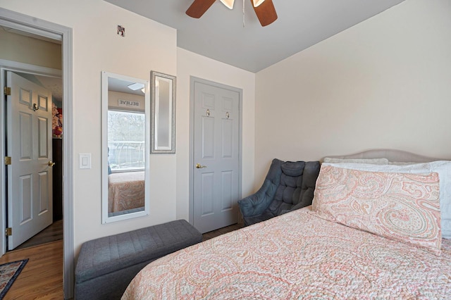 bedroom featuring a ceiling fan and wood finished floors