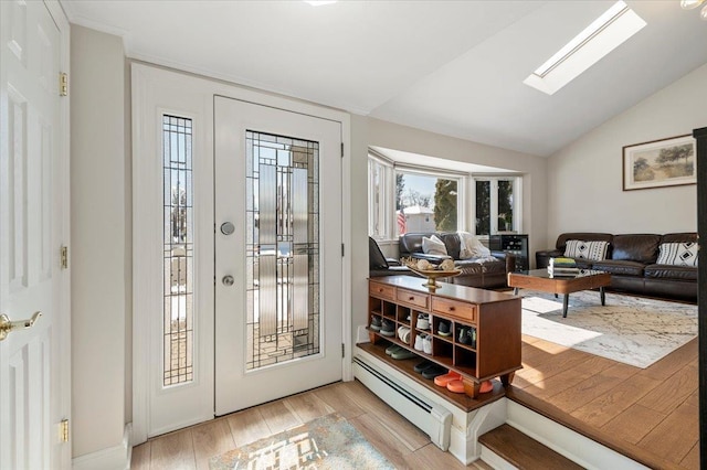 doorway featuring lofted ceiling with skylight, light wood-style flooring, and baseboard heating