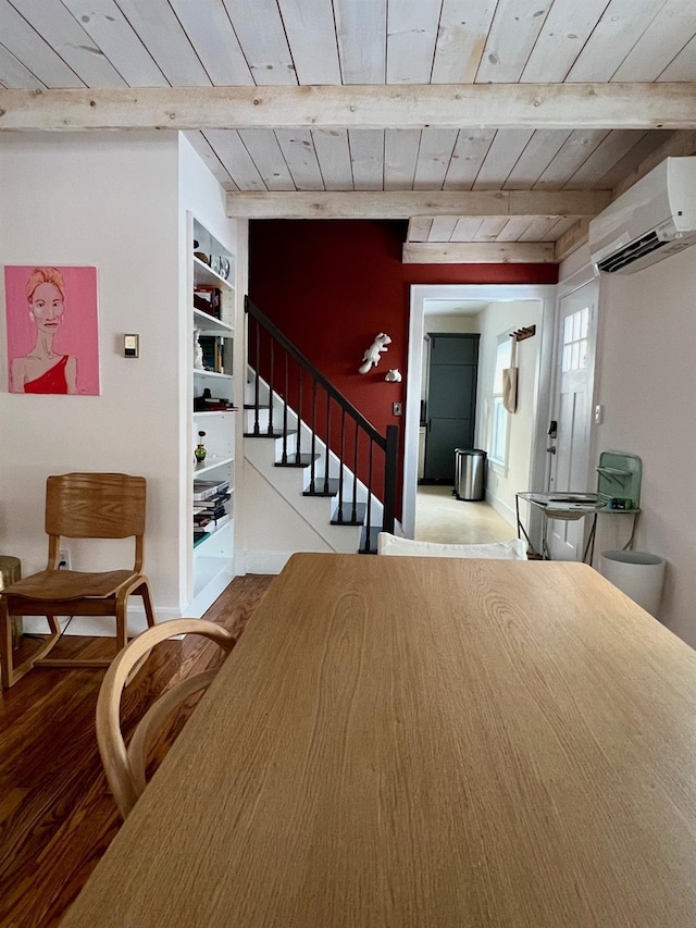 dining area featuring wood ceiling, an AC wall unit, beamed ceiling, and stairs