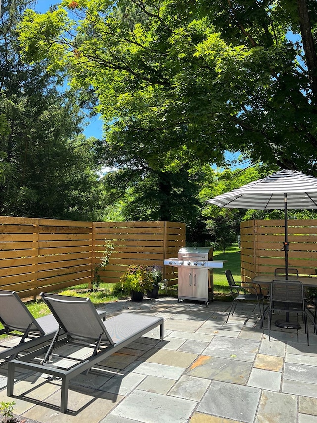 view of patio / terrace featuring outdoor dining space and fence