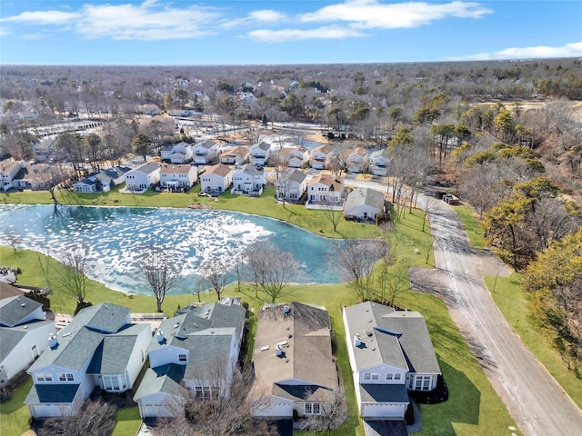 birds eye view of property with a water view and a residential view