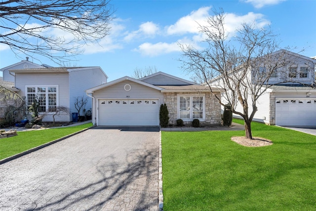 view of front of home with driveway, a garage, and a front yard