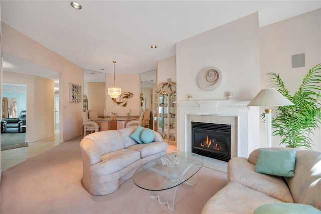 living area with recessed lighting, a fireplace, and light tile patterned flooring