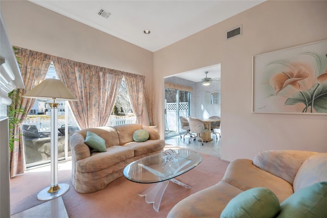 living room featuring recessed lighting, visible vents, and light tile patterned flooring