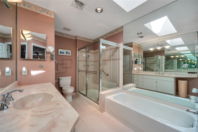 full bathroom with tile patterned flooring, a garden tub, a shower stall, and toilet