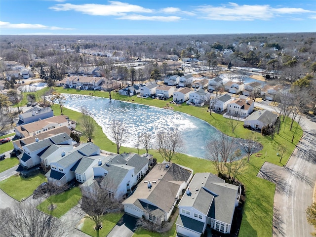 birds eye view of property with a water view and a residential view