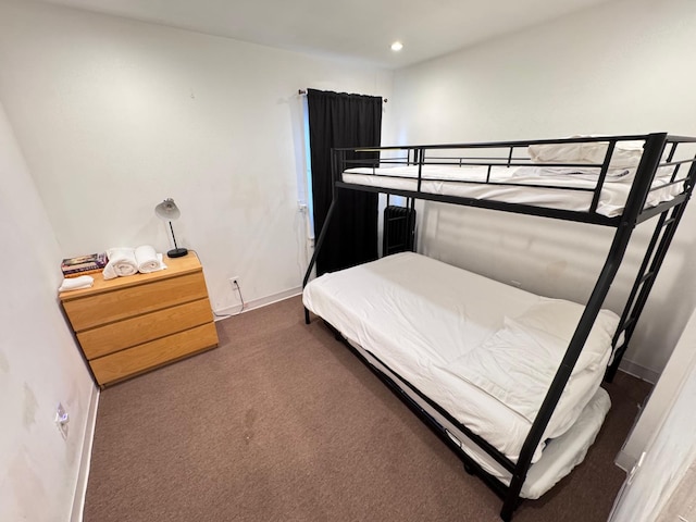 bedroom featuring baseboards, dark carpet, and recessed lighting