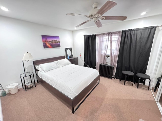 bedroom featuring a ceiling fan, recessed lighting, light colored carpet, and radiator