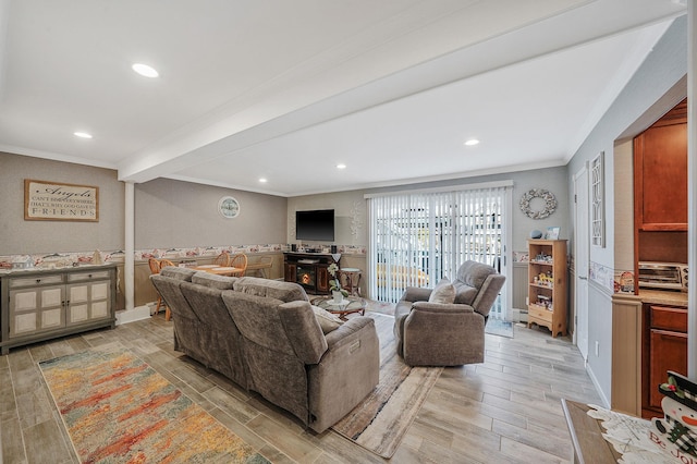 living area featuring beam ceiling, recessed lighting, light wood-style flooring, and crown molding