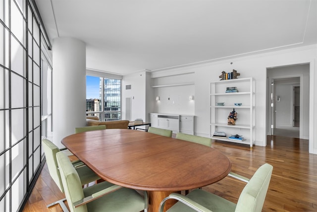 dining space with dark wood-type flooring