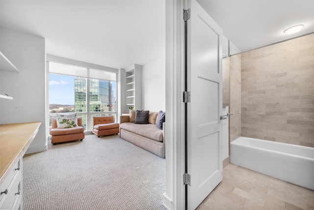 living area featuring floor to ceiling windows