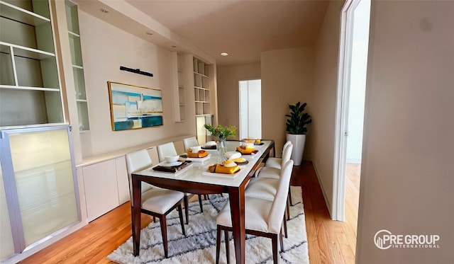 dining area featuring light wood-style floors and recessed lighting