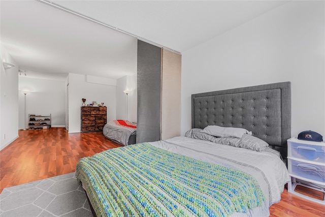 bedroom featuring wood finished floors