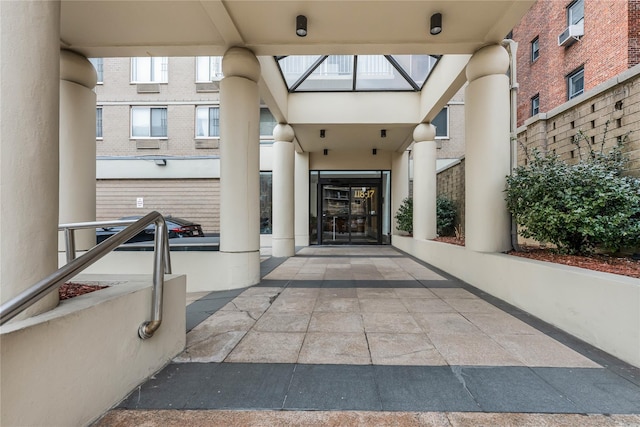 view of exterior entry featuring stucco siding