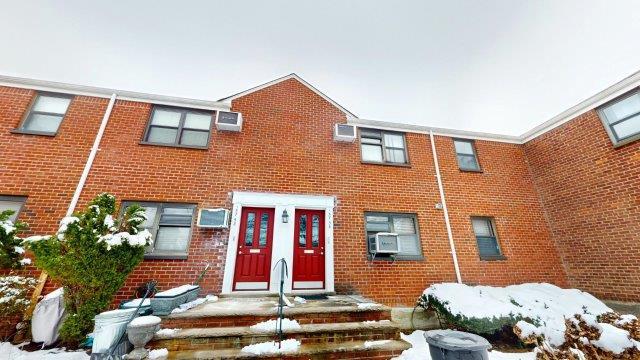 15756 17th Ave Unit 5-36, Whitestone, NY 11357 - view of property featuring cooling unit and brick siding