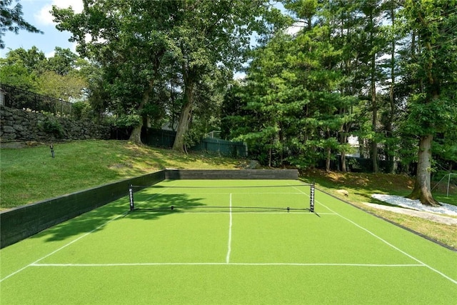 view of sport court with fence