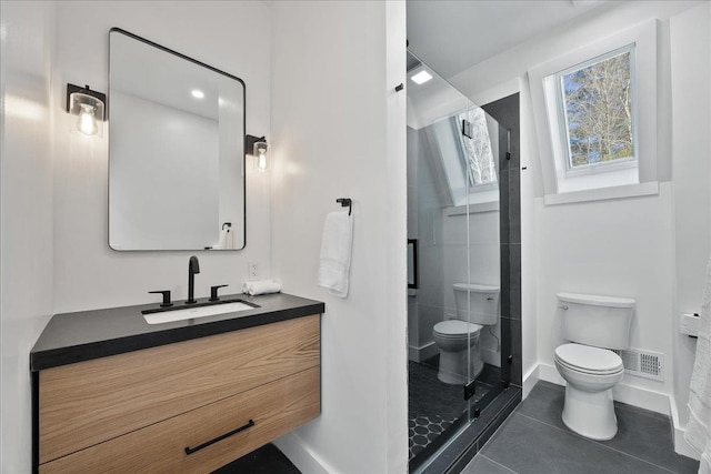 full bathroom with visible vents, toilet, vanity, tile patterned flooring, and baseboards