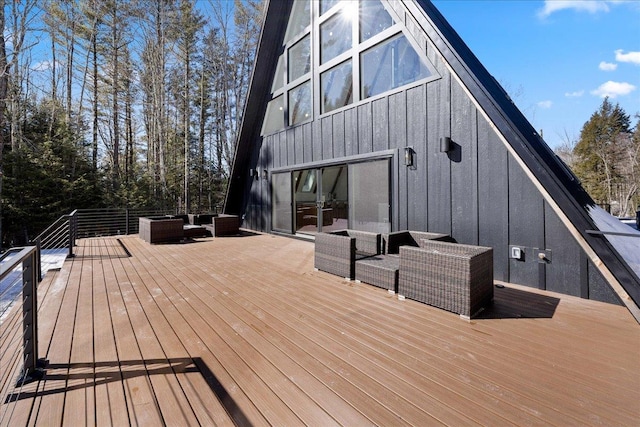 wooden deck featuring outdoor lounge area